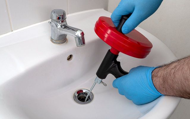 Drain cleaning service in progress